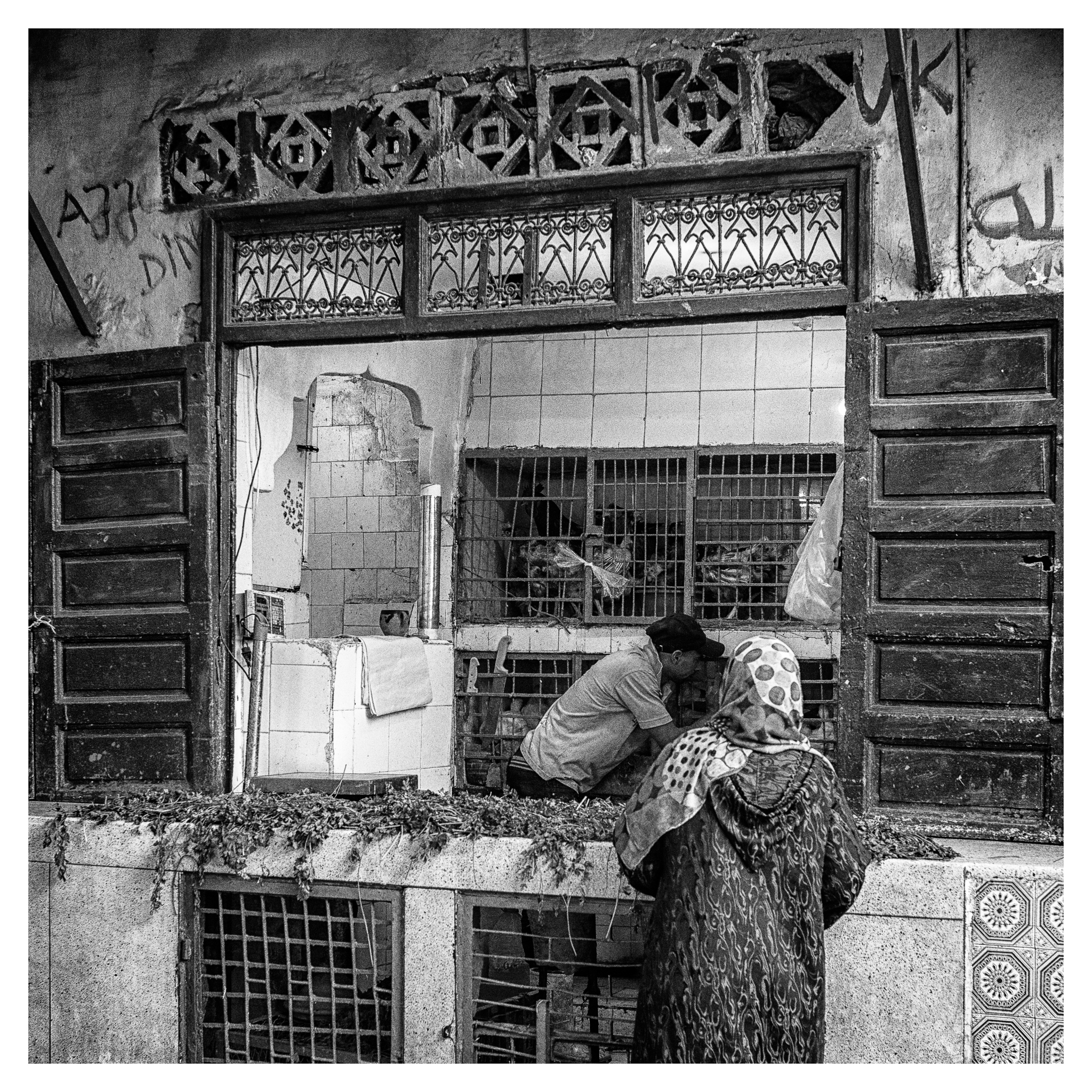 Moroccan women buying fresh chicken